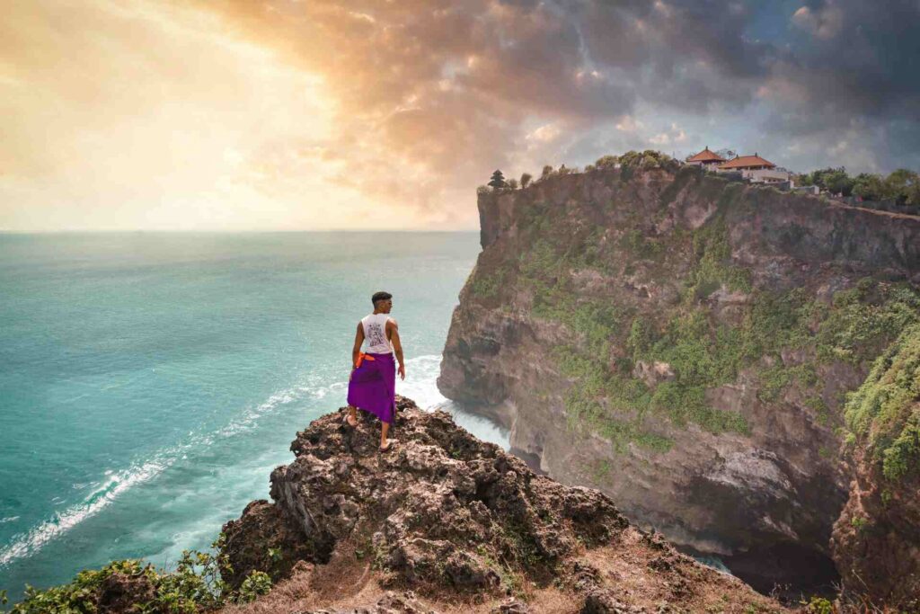 A person standing on cliffs in Bali