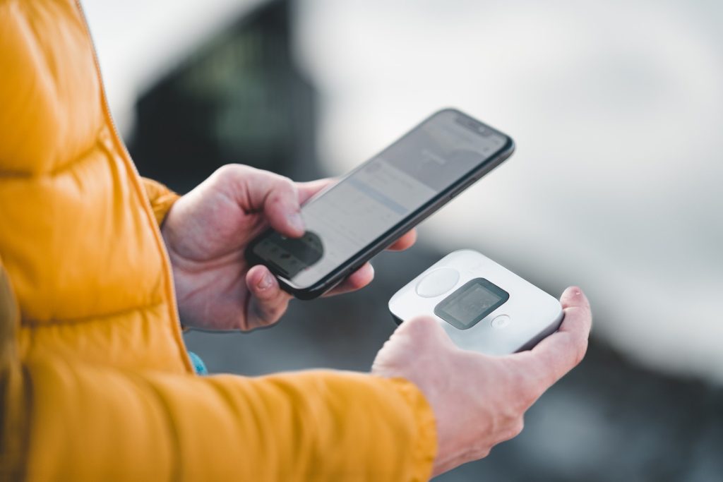 man using a pocket wi fi