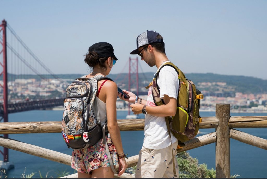 Tourists using phone in Lisbon,