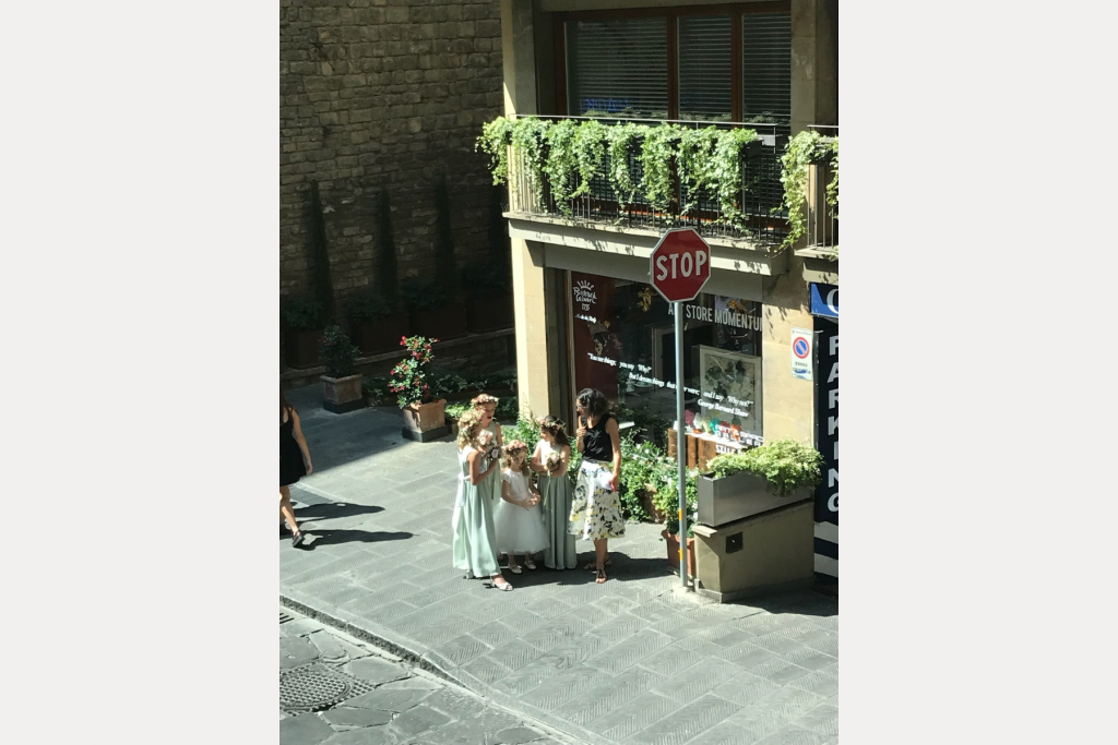 Some adorable young girls dressed for a special occasion in the flowers of Florence.